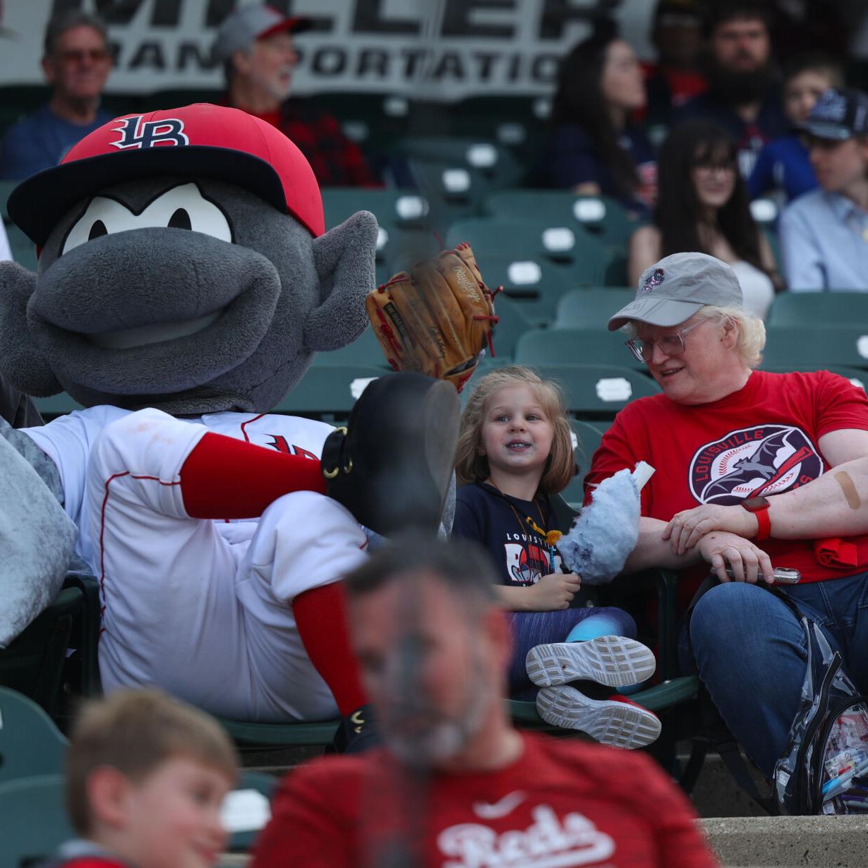 Buddy Bat sits with a young fan.JPG